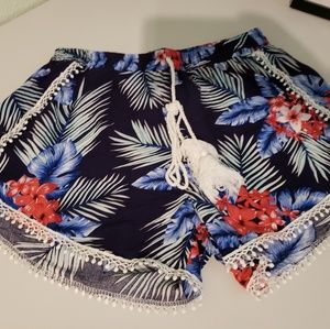 Cute, tropical navy blue shorts with pom-poms